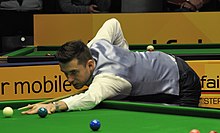 Mark Selby jugando un tiro