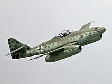 A replica of a German Messerschmitt Me 262, one of the first combat aircraft to fly under turbojet power Me 262 flight show at ILA 2006 (cropped).jpg