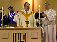 A Methodist minister celebrating the Eucharist