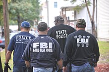 SPD officers, MSP troopers, and FBI agents during an operation part of the C3 policing initiative in Springfield Multiple agencies mspc3 Anvil 4.jpg