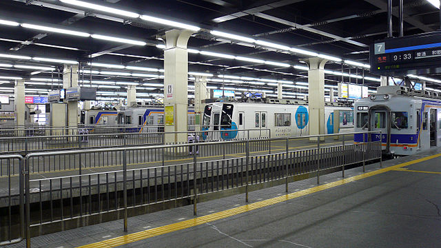 Nankai station platforms, with several trains waiting at different platforms