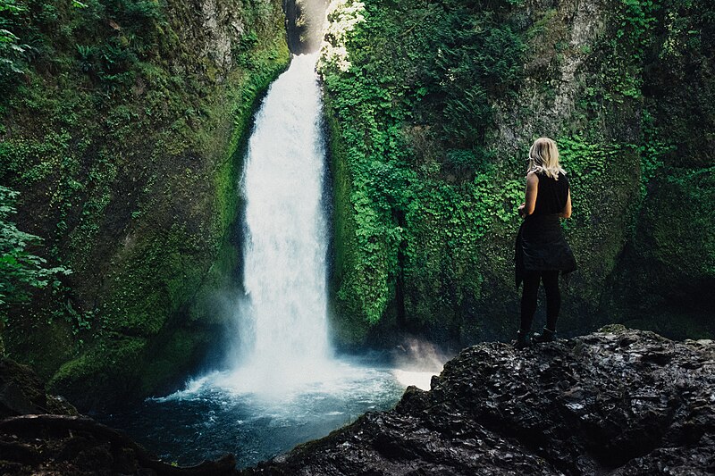 File:On a rock near a waterfall (Unsplash).jpg