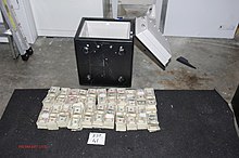 One of four safes with money totalling $4.3 million found in the attic of Chris George's mother (FBI photo, March 2010) One of four saves with money found in the attic of Christopher George's mother.jpg