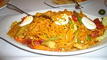 Pancit luglug topped with hardboiled eggs, shrimp, and chorizo Pancit.JPG