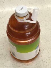 bottle of apple juice with added handle