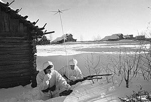 English: A radio operator making a report to the headquarters Русский: Радист передает донесение в штаб