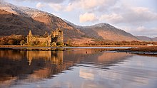 Loch Awe, site of the decisive clan battle, with Kilchurn Castle (seat of Clan Campbell) on the left Reflections on Loch Awe.jpg