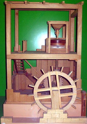 Model of a Roman water-powered grain-mill described by Vitruvius. The millstone (upper floor) is powered by an undershot waterwheel by the way of a gear mechanism (lower floor)