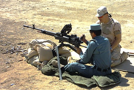 A Romanian Gendarmerie instructor (right) in a training mission with a member of the Afghan National Police