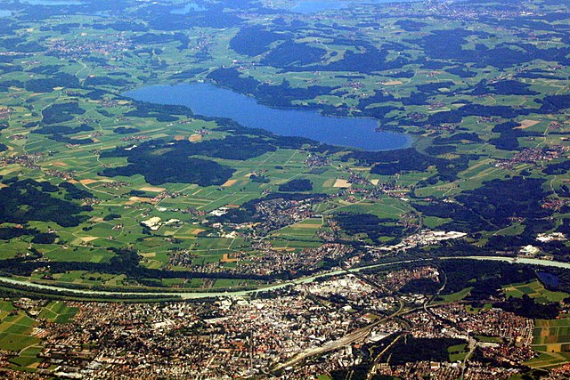 Aerial view of Rosenheim (foreground) and Simssee (background); in between from left to right the Inn river