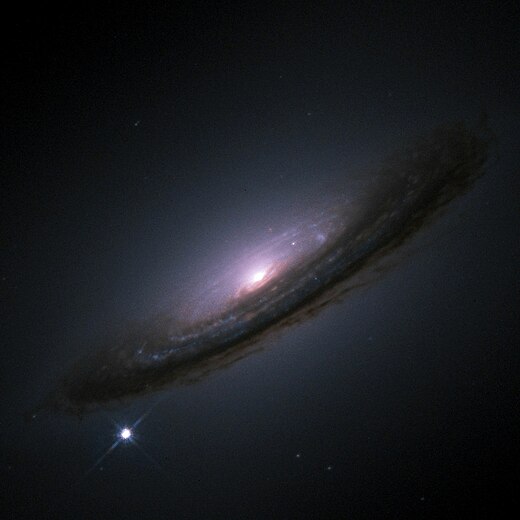 SN 1994D (bright spot on the lower left), a type Ia supernova within its host galaxy, NGC 4526