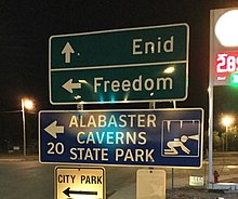 Sign pointing to Enid, Freedom, and Alabaster Caverns along highway 412 Sign pointing to Enid, Freedom, and Alabaster Caverns along highway 412.jpg