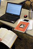 An editor and her research material during the Cornell University 2017 Art + Feminism Wikipedia edit-a-thon. Olin Library, March 11, 2017.