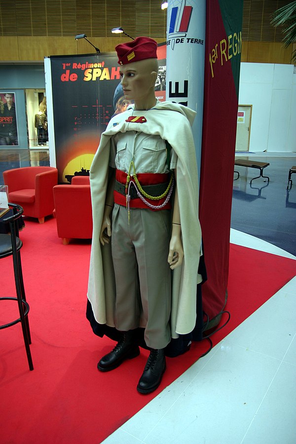 French Spahi uniform today: 2006 pattern parade uniform for a maréchal des logis of the 1st Spahi Regiment, with red bonnet de police and distinctive 