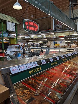 Interior of Municipal Market, featuring original exterior sign (now lit and displayed inside) Sweet Auburn Market, Atlanta (48984293028).jpg