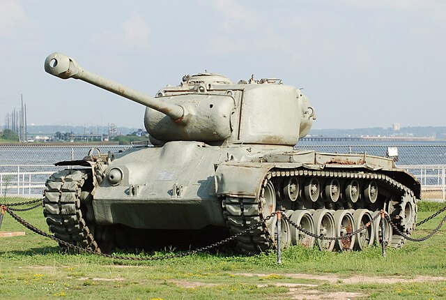 A sun shield covering the top part of a tank [1]