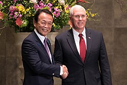 Tarō Asō and Mike Pence shake hands