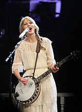 Swift playing a banjo