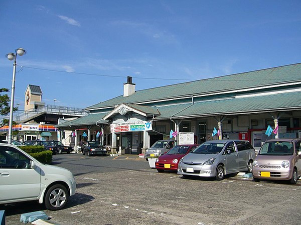 A view of the station entrance looking north. The structure with the pointed tower is the Rainbow Bridge.