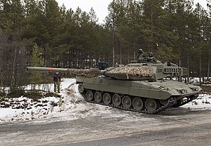 Spanish Leopard 2E participating in Exercise Trident Juncture 18 hold a defensive position against U.S. Marines with 2nd Tank Battalion, 2D Marine Division, near Folldal, Norway on Nov. 3, 2018. Trident Juncture 18 enhances the U.S. and NATO Allies' and partners' abilities to work together collectively to conduct military operations under challenging conditions. Trident Juncture 2018 181103-N-FO714-221.jpg