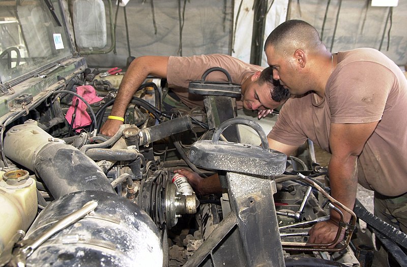 File:U.S. Army SPC. Miguel Souffront (left) and PFC Miguel Barreto mechanics from HHC 130th Engineer Battalion Puerto Rico Army National Guard, replace a fan cluth of a M-998 HMMWV at th - DPLA - 76c585ef70af8ac32a8584c8c8b41e34.jpeg