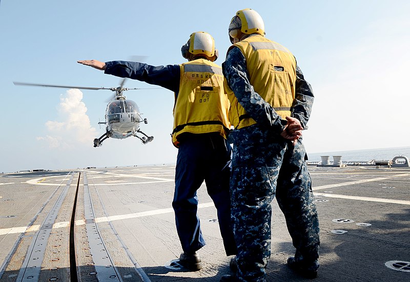 File:U.S. Navy Boatswain's Mate 3rd Class Matthew Fountain, left, and Boatswain's Mate 2nd Class Carlos Medina guide an Indonesian navy Bo105 helicopter during flight operations aboard the guided missile destroyer 130524-N-YU572-130.jpg