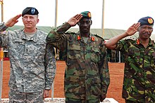 Maj. Gen. William B. Garrett III, commander of U.S. Army Africa, Gen. Nyakayirima Aronda, Chief of Defense Forces, Ugandan People's Defense Force and Gen. Jeremiah Kianga, Chief of General Staff, Kenya, render honors during the opening ceremony for Natural Fire 10, Kitgum, Uganda, Oct. 16, 2009. US ARMY AFRICA NF10 0016.jpg