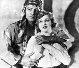 Rudolph Valentino as Sheik Ahmed and Agnes Ayres as Lady Diana.