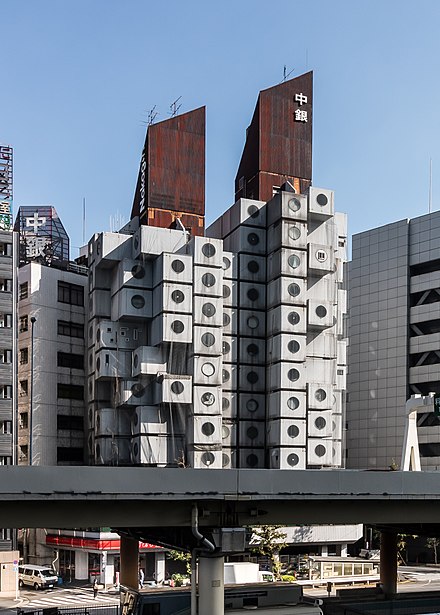 The Nakagin Capsule Tower in Tokyo displays small apartment units (capsules) attached to a central building core