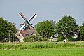 Zicht op Woudsend met molen 't Lam