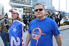 Protester wearing a QAnon t-shirt at a Proud Boys march for Trump in December 2020. 90.ProudBoys.WDC.12December2020 (50720494848).jpg