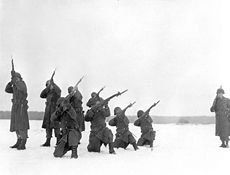 Members of C Company, 9th Engineers, conduct a memorial service for those killed during the Siege of Bastogne, 22 January 1945. 9th Armored Engineer Battalion Bastogne memorial service2.jpg