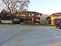 A house and parking lot in McPherson, Kansas (c0fb151bd9114b0189ecc9ac1d9e3717).JPG