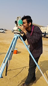 A student using a theodolite in field A student using a Theodolite in field.jpg