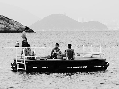 A Some Teenage Boys playing with each other in the Golden Beach at Tuen Mun