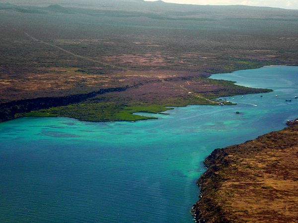 The view from an aircraft flying from Seymour Airport on Baltra Island (on the right), previously known as South Seymour Island, showing Santa Cruz on