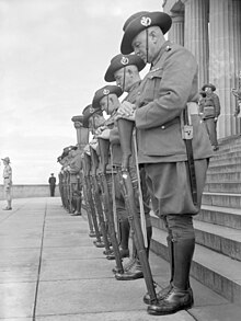 Australian guard of honour on Remembrance Day 1943, resting on arms reversed Awm res on arms reversed.jpg