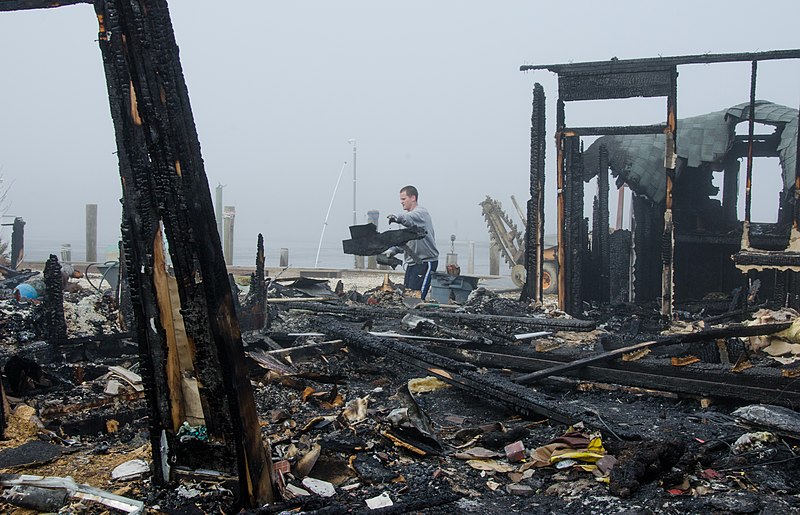 File:Bayville, N.J., Jan. 30, 2013 -- A man helps his uncle clear debris form his home, which burned down during Hurricane Sandy. The fire started when the electrical panel got flooded. - DPLA - b8352778c8ca8cf682552f2807a198ae.jpg