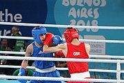 Deutsch: Boxen bei den Olympischen Jugendspielen 2018 Tag 12, 18. Oktober 2018 - Kampf um Bronze im Leichten Weltergewicht Jungen – Hassan Azim (Großbritannien, rot) schlägt Mohammed Boulaouja (Marokko, blau) RSC; Ringrichter ist Wulfren Olivares Peréz (Kolumbien). English: Boxing at the 2018 Summer Youth Olympics on 18 October 2018 – Bronze Medail Match Light Welterweight Boys - Hassan Azim (Great Britain, red) beats Mohammed Boulaouja (Morocco, blue) RSC; Referee is Wulfren Olivares Peréz (Columbia). Español: Boxeo en los Juegos Olímpicos Juveniles de Verano de 2018 en 18 de octubre de 2018 - Medalla de bronce de los hombres ligeros de peso welter: Hassan Azim (Gran Bretaña, rojo) vence a Mohammed Boulaouja (Marruecos, azul) RSC; El árbitro es Wulfren Olivares Peréz (Colombia).