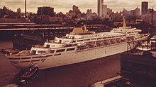 Oceanic in New York City in 1973 CRUISE SHIP OCEANIC IN DOCK AT NEW YORK HARBOR - NARA - 548403 (cropped).jpg