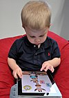 Child with Apple iPad.jpg