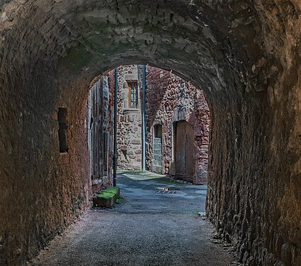 Covered walkway from Avenue de la Tour in Clairvaux-d'Aveyron, Aveyron, France