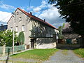 Farm with stable house, barn, courtyard wall with gate entrance and courtyard surface