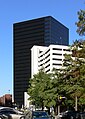 Dallas, Texas; in the background one of the towers of Plaza of the Americas, in the foreground a parking garage