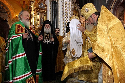 Kirill being presented with the patriarchal koukoulion during his enthronement