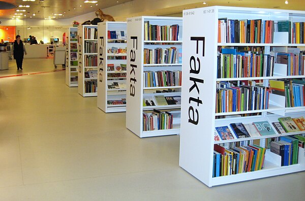 Non-fiction books at a Danish library, shelves displaying the word Fakta, Danish for "Facts"
