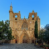 The main front of the Lala Mustafa Pasha Mosque, once Saint Nicholas' Cathedral, Famagusta, Cyprus (note minaret added top left)