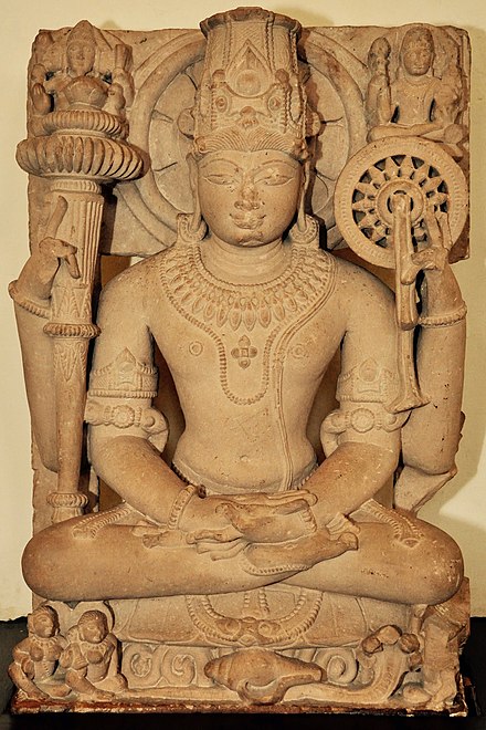 Chakra in the left upper hand of a seated Vishnu, medieval sculpture currently in Mathura museum.