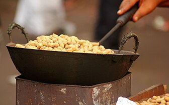 Frying Peanuts on a street shop of Dhaka
