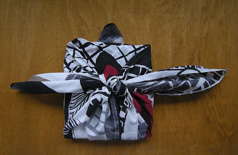 File:Furoshiki designed by F. Hundertwasser, used for wrapping a book.jpg
